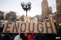 FILE - Demonstrators participate in a Presidents Day protest against President Donald Trump's immigration policy at Union Square in New York, Feb. 18, 2019.