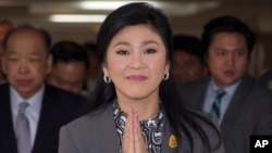 FILE - Thai Prime Minister Yingluck Shinawatra arriving at the office of Permanent Secretary for Defense on the outskirts of Bangkok, Thailand, Friday, Jan. 17, 2014.