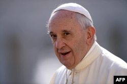 Pope Francis arrives in St Peter's square at the Vatican on Sept. 9, 2015, for his weekly general audience.