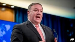 FILE - Secretary of State Mike Pompeo speaks to reporters at a news conference at the State Department in Washington.