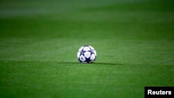 FILE - A soccer ball is seen on the pitch before kick off between Borussia Dortmund and Sporting Lisbon, Feb. 11, 2016. 