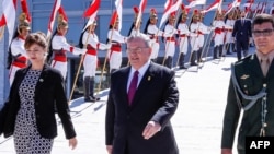 FILE - The handout photo released by the Brazilian presidency shows Greece's ambassador to Brazil, Kyriakos Amiridis, center, in Brasilia, May 25, 2016.