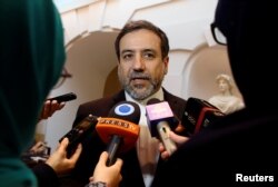 FILE - Iran's top nuclear negotiator, Abbas Araqchi, talks to journalists after meeting senior officials from the United States, Russia, China, Britain, Germany and France in a hotel in Vienna, Austria, Oct. 19, 2015.