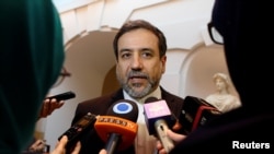 FILE: Iran's top nuclear negotiator, Abbas Araqchi, talks to journalists after meeting senior officials from the United States, Russia, China, Britain, Germany and France in a hotel in Vienna, Austria, Oct. 19, 2015. 