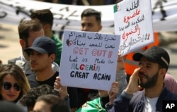 Algerian students march with placards during a protest in Algiers, Algeria, Apr. 2, 2019.