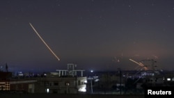 Missile fire is seen over Daraa, Syria, May 10, 2018.