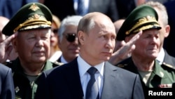 Russian President Vladimir Putin attends a wreath-laying ceremony marking the 75th anniversary of the Nazi German invasion, by the Kremlin walls in Moscow, Russia, June 22, 2016.