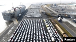 FILE - Volkswagen export cars are seen in the port of Emden, beside a VW plant, in Germany, March 9, 2018. 