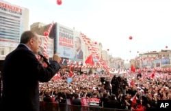 FILE - Turkey's President Recep Tayyip Erdogan addresses his supporters during a rally in Istanbul, March 26, 2017.