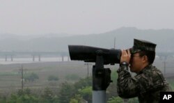 A South Korean marine force member looks toward the North's side at the Imjingak Pavilion in Paju near the border village of Panmunjom, South Korea, May 16, 2018.