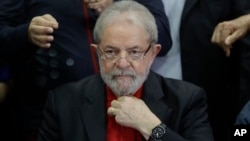 FILE - In this July 13, 2017, photo, former Brazilian President Luiz Inacio Lula da Silva prepares to speak to the press and supporters at the headquarters of the Worker's Party, in Sao Paulo, Brazil.