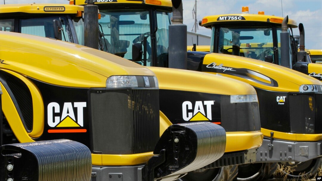 FILE - Earth-moving tractors and equipment made by Peoria, Illinois-based Caterpillar Inc. are seen in Clinton, Illinois, June 20,2012. Caterpillar's recent decision to move 300 top headquarters jobs to the Chicago area made Peoria the latest city with a vacuum to fill.