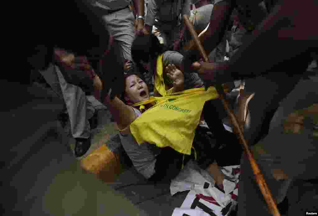 Tibetan exiles are detained by police during a protest outside of a meeting between visiting Chinese President Xi Jinping and Indian Prime Minister Narendra Modi in New Delhi, India. 