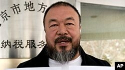 Chinese dissident artist Ai Weiwei shows his tax guarantee slips as he leaves the the Beijing Local Taxation Bureau, China. Ai went to the local tax bureau to fill in paperwork for a $1.3 million guarantee, and told reporters he feels like he was paying a