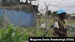 A U.N. peacekeeper stands guard at the U.N. Mission in South Sudan (UNMISS) base in Malakal, where a South Sudanese army soldier reportedly opened fire on Thursday, May 28, 2015.