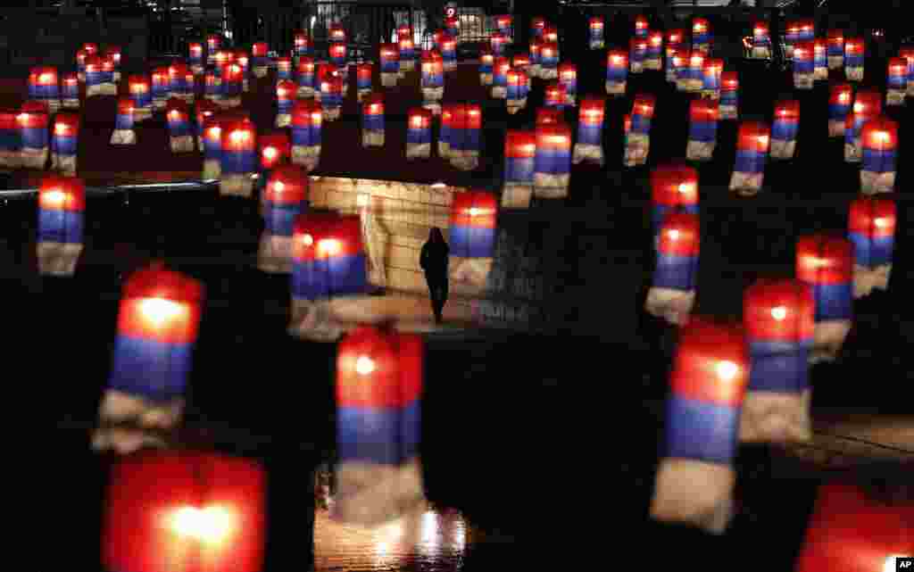 A visitor looks at lanterns during the Seoul Lantern Festival, which held from Nov. 1-17, along Cheonggye stream in Seoul, South Korea.