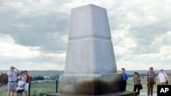 FILE - The Little Bighorn Battlefield National Monument stands in Crow Agency, Mont. The monument recognizes the General George Custer's last stand and the victory of Sioux leaders Sitting Bull and Crazy Horse, June 25-26, 1876.