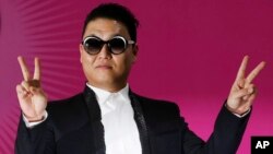 South Korean rapper PSY poses during a news conference for his concert "Happening" in Seoul, South Korea, April 13, 2013.