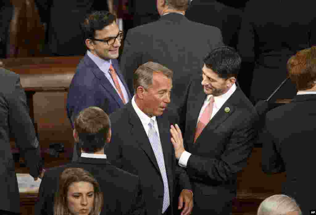 House Ways and Means Committee Chairman Rep. Paul Ryan, R-Wis. (right) greets House Speaker John Boehner of Ohio as the House of Representatives gathered for the opening session of the 114th Congress, on Capitol Hill in Washington, Jan. 6, 2015.