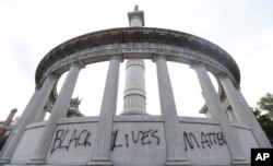The words “Black Lives Matter” spray painted on a monument to former Confederate President Jefferson Davis in Richmond, Va., June 25, 2015.