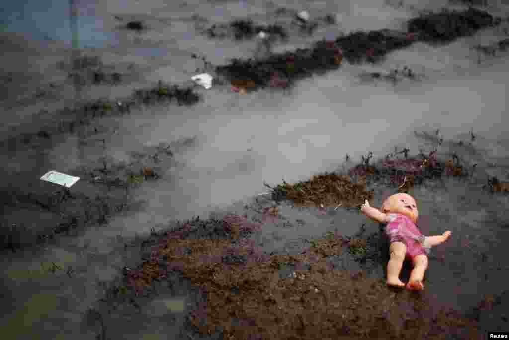 A doll belonging to a migrant, part of a caravan of thousands from Central America trying to reach the United States, is seen on the floor in a temporary shelter in Tijuana, Mexico, Nov. 29, 2018.