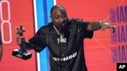 FILE - Davido accepts the best international act award at the BET Awards at the Microsoft Theater on Sunday, June 24, 2018, in Los Angeles.