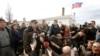 FILE - Colonel Sergei Storozhenko, commander of the military unit in the village of Perevalnoye, Crimea, talks to the media outside Simferopol, March 6, 2014, the day that Crimea's parliament voted to join Russia.