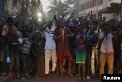 People cheer Malian soldiers in front of the Radisson hotel in Bamako, Mali, Nov. 20, 2015.