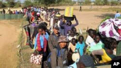 Civilians fleeing violence seek refuge at the UNMISS compound in Bor, capital of Jonglei state, in South Sudan. 