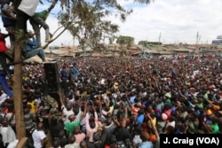 Kenya's opposition leader Raila Odinga speaks to a crowd during a rally in the Nairobi slum of Kibera, Aug. 13, 2017.