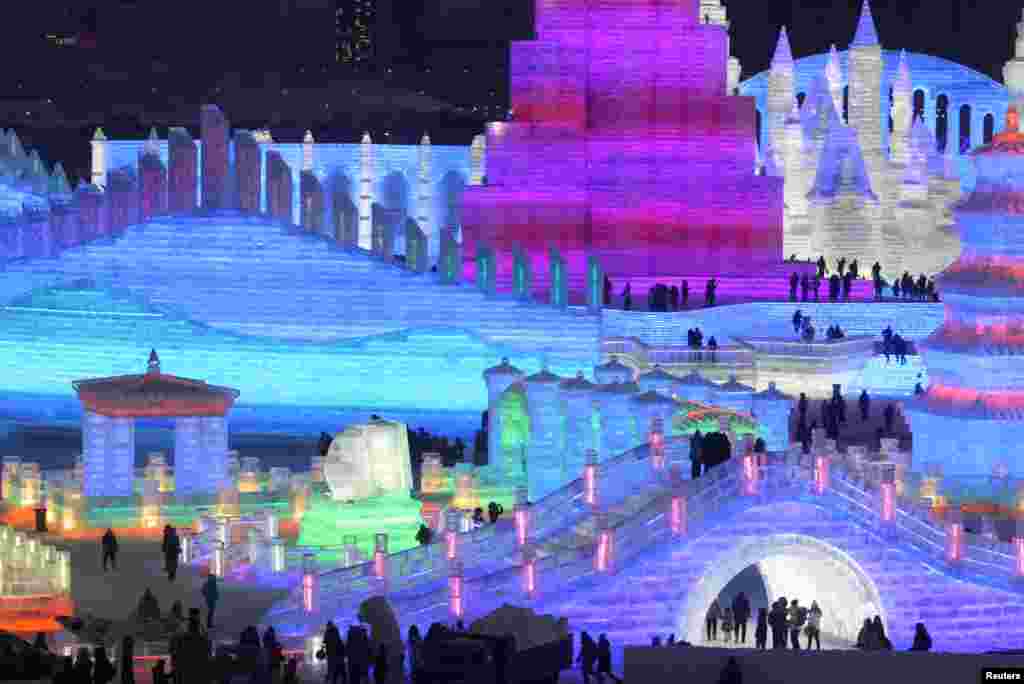 People visit illuminated ice sculptures at the Ice and Snow World park ahead of the Harbin International Ice and Snow Sculpture Festival, in Harbin, Heilongjiang province, China, Dec. 23, 2018.