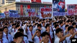 FILE - Tens of thousands of North Koreans rally at Kim Il Sung Square carrying placards and propaganda slogans as a show of support against United Nations' sanctions, Aug. 9, 2017, in Pyongyang, North Korea. The United States is seeking a new round of sanctions on Monday.