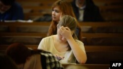 A journalism student attends a lecture at Moscow State University. (Natalia Kolesnikova/AFP)