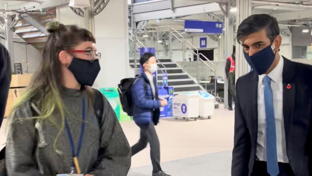 A young climate activist questions Britain's Chancellor of the Exchequer Rishi Sunak on climate change policies as the UN Climate Change Conference (COP26) takes place, in Glasgow, Scotland, Britain, Nov. 3, 2021