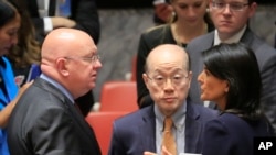 United Nations Ambassadors Vasily Nebenzya of Russia, left, Liu Jieyi of China, center, and Nikki Haley of the U.S., right, confer after the United Nations non-proliferation meeting on North Korea, Sept. 4, 2017 at U.N. headquarters. 