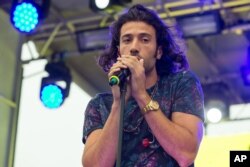 Vocalist Nasri Atweh of the band Magic! performs on stage during the Pandora Presents The 2014 Summer Party at The Santa Monica Pier, Aug. 09, 2014, in Santa Monica, Calif.