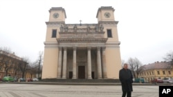 Miklos Beer, the bishop of Vac, walks in front of the cathedral in Vac, Hungary, March 9, 2017.