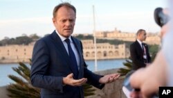 European Council President Donald Tusk speaks with the media prior to an EU summit outside his hotel in Valletta, Malta on Feb. 2, 2017. 