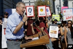 FILE - In this Oct. 24, 2017 file photo, Tom Steyer speaks at a rally calling for the impeachment of President Donald Trump in San Francisco. Steyer is doubling his spending on ads calling for Trump's impeachment to $20 million.