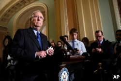 FILE - Senate Majority Leader Mitch McConnell of Kentucky listens to a question as he speaks to the media on Capitol Hill in Washington, Nov. 27, 2018.