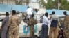 This image made from video shows the scene following a bomb attack on a van carrying U.N. employees in Garowe, in the semi-autonomous Puntland region of northern Somalia, April 20, 2015. 