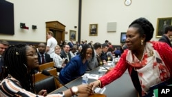 Rep. Sheila Jackson Lee D-Texas, shake hands with Marjory Stoneman Douglas High School senior Aalayah Eastmond, during a House Judiciary Committee hearing on gun violence, at Capitol Hill in Washington, Feb. 6, 2019.
