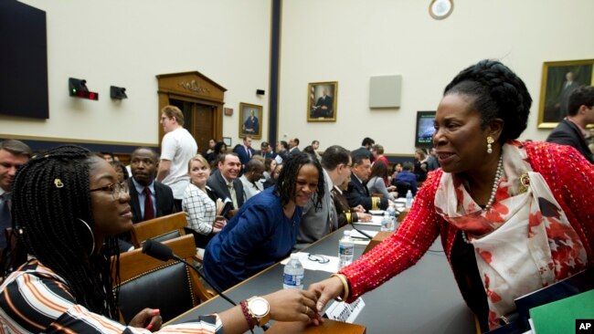 Rep. Sheila Jackson Lee D-Texas, shake hands with Marjory Stoneman Douglas High School senior Aalayah Eastmond, during a House Judiciary Committee hearing on gun violence, at Capitol Hill in Washington, Feb. 6, 2019.