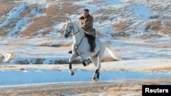 North Korean leader Kim Jong Un rides a horse during snowfall in Mount Paektu in this image released by North Korea's Korean Central News Agency (KCNA) on October 16, 2019.