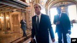 FILE - Special counsel Robert Mueller departs after a closed-door meeting with members of the Senate Judiciary Committee about Russian meddling in the election and possible connection to the Trump campaign, at the Capitol in Washington, June 21, 2017.