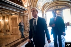 FILE - Special counsel Robert Mueller departs after a closed-door meeting with members of the Senate Judiciary Committee about Russian meddling in the election and possible connection to the Trump campaign, at the Capitol in Washington, June 21, 2017.
