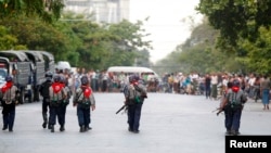 Policemen patrol in a Muslim neighbouhood in Mandalay, Myanmar, July 4, 2014. 