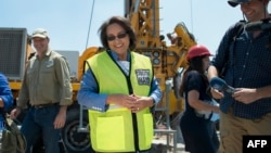 Cape Town City Mayor Patricia de Lille (C) talks to media at a site where the city council has ordered drilling into the aquifer to tap water, in Mitchells Plain, about 25km from the city center on Jan. 11, 2018 in Cape Town.