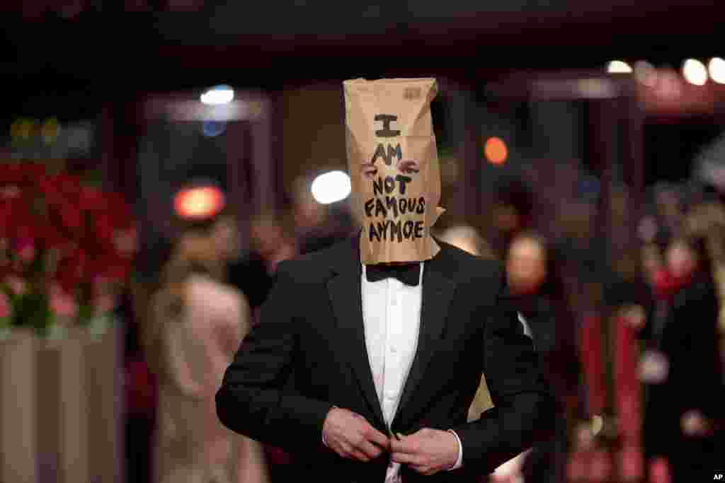 Actor Shia LaBeouf poses for photographers, with a paper bag over his head that says &#39;I am not famous anymore,&#39; on the red carpet for the film &quot;Nymphomaniac&quot; at the International Film Festival Berlinale in Berlin.