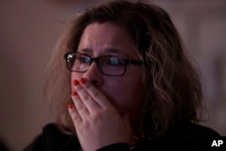 Angelica Magana, 34, a Dreamer, who was brought to the United State at the age of eight, reacts to President Donald Trump as he lays out is immigration policy during a State of the Union watch party in Chicago, Jan. 30, 2018.